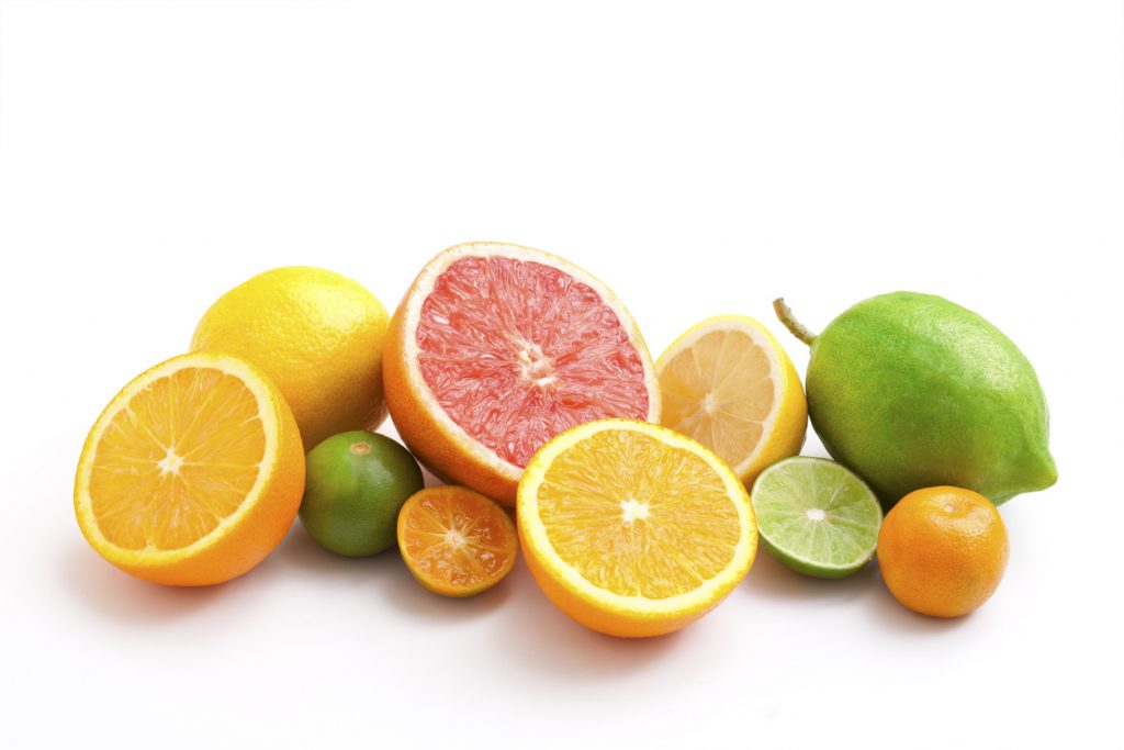 Various citrus fruits on a white background