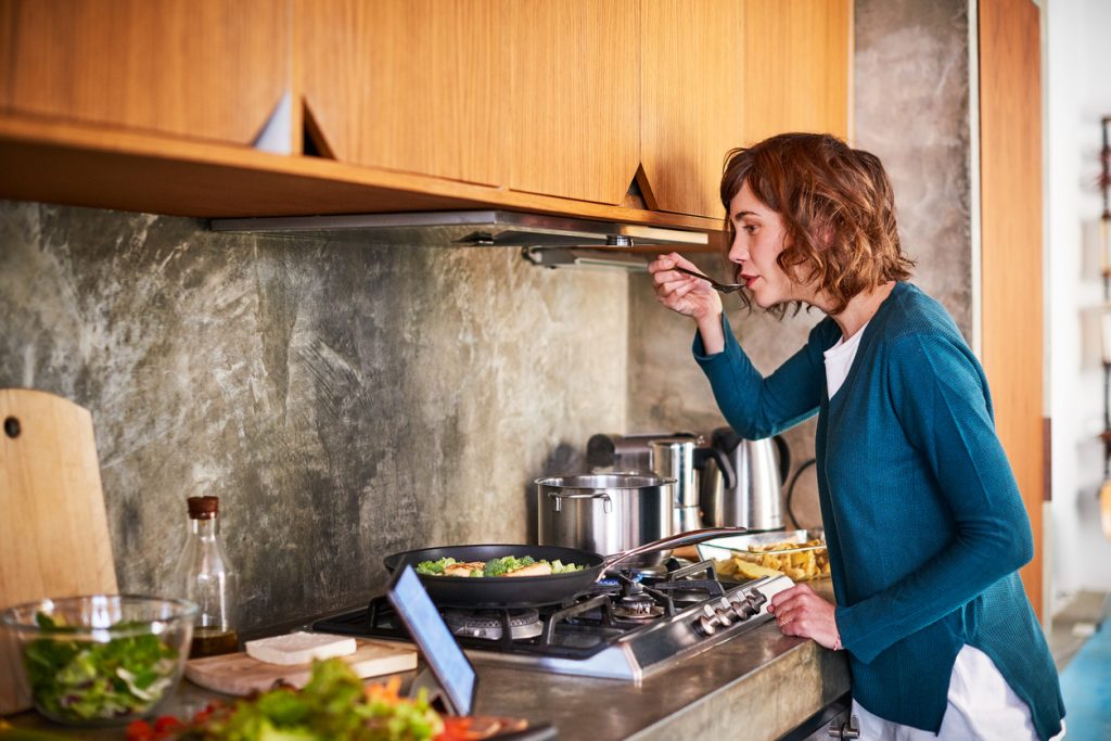 Woman cooking a healthy meal - easy superfood recipes