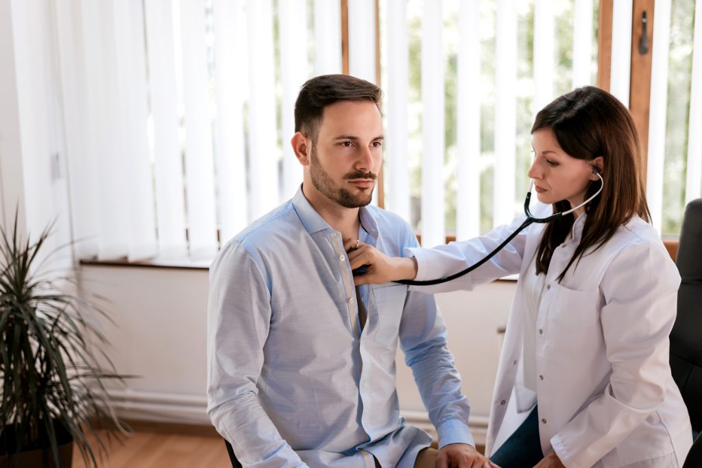 Male patient visiting doctor's office - Affordable Health Insurance